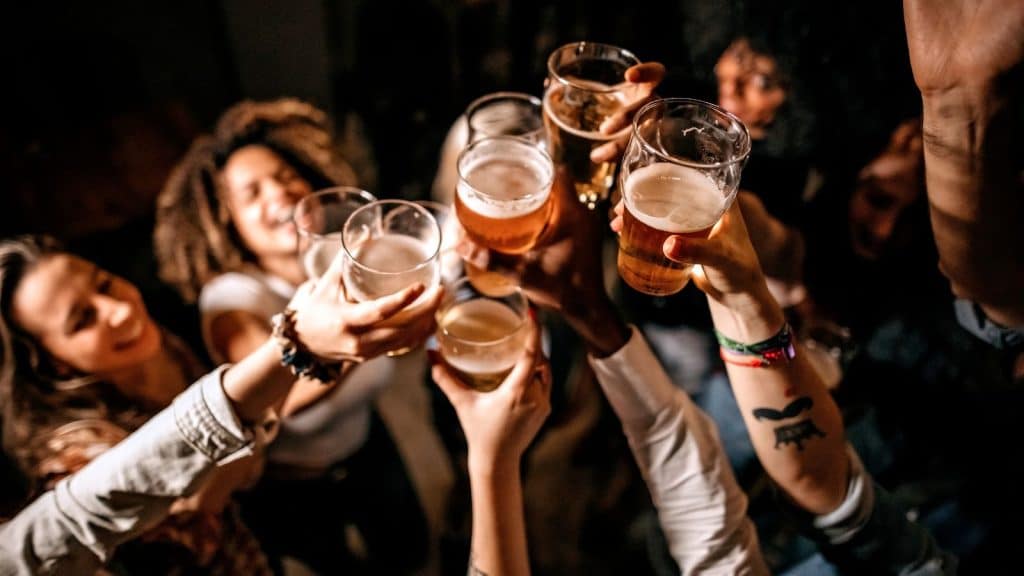 Cheers your beers on a pub crawl with your new drinking mates